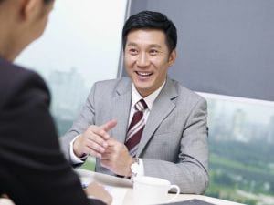 asian business people discussing business in office.